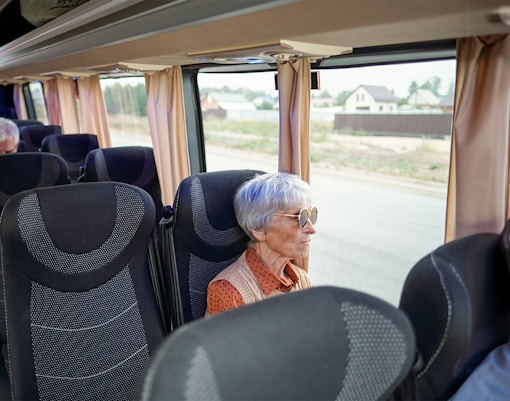 Bus interior with passengers traveling from Madrid to Puy du Fou España.