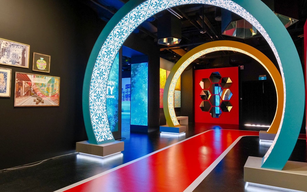 Interactive exhibit with colorful arches and art at Singapore Flyer.