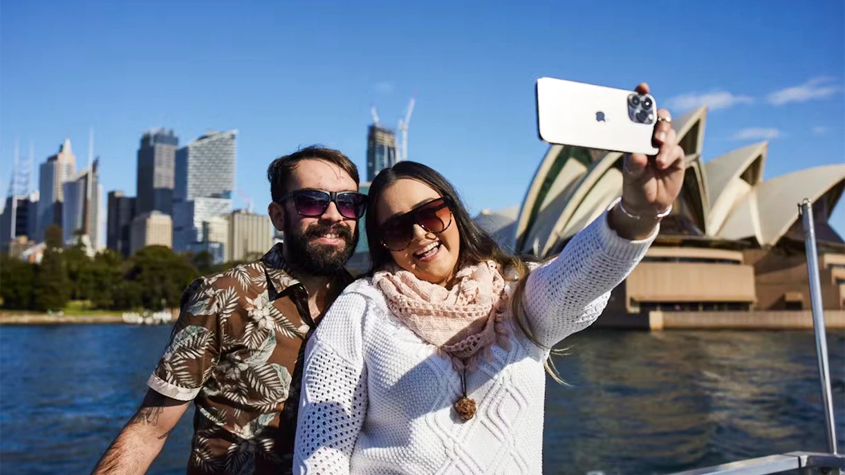 Couple taking a selfie during a Sydney Harbour Cruise