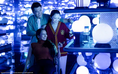 People exploring magical orbs at the Ministry of Magic, Harry Potter Visions of Magic tour.