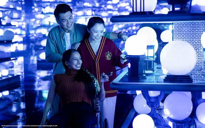 People exploring magical orbs at the Ministry of Magic, Harry Potter Visions of Magic tour.