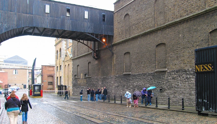 Guinness Storehouse exterior with Big Bus Dublin tour bus in front.