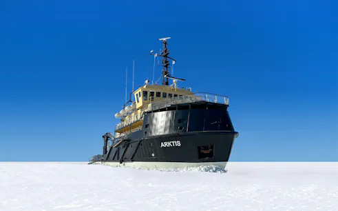 Icebreaker Arktis navigating frozen sea on Kemi cruise.