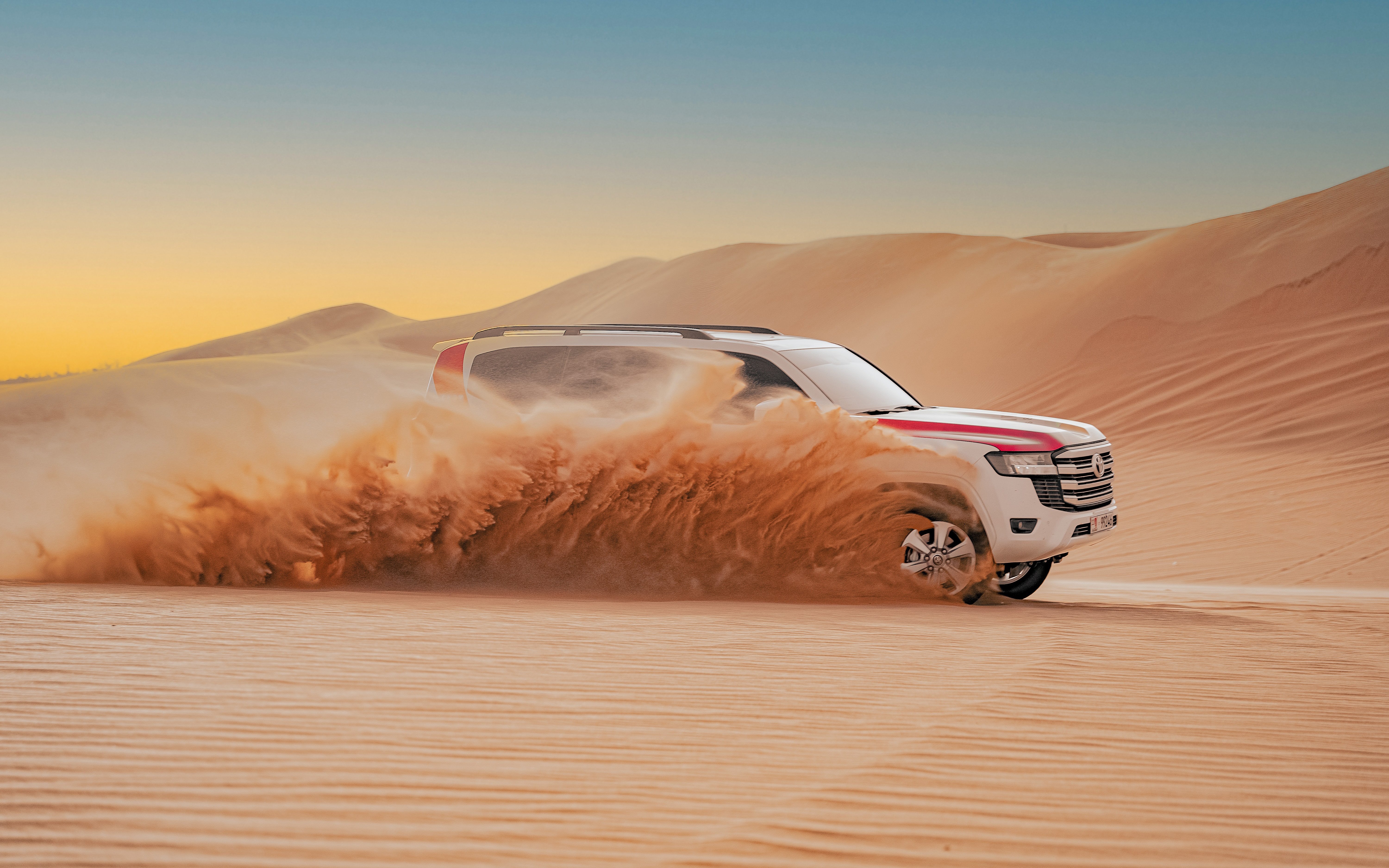 4X4 vehicle dune bashing in Abu Dhabi desert safari.