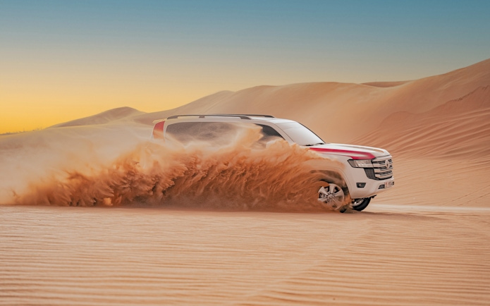 4X4 vehicle dune bashing in Abu Dhabi desert safari.