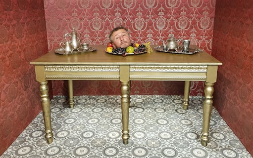 Head illusion on table at Museum of Fantastic Illusions.