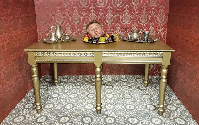 Head illusion on table at Museum of Fantastic Illusions.