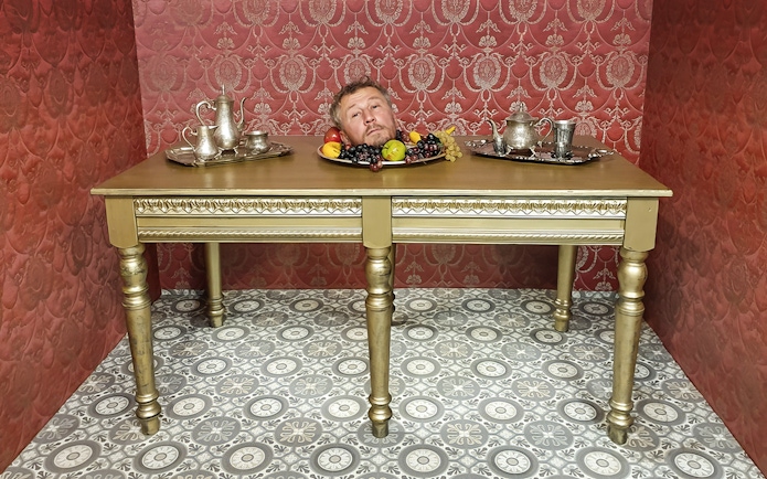 Head illusion on table at Museum of Fantastic Illusions.