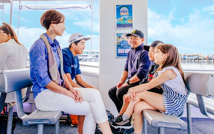 Family enjoying Hop-On Hop-Off Sightseeing Cruise on Gold Coast.
