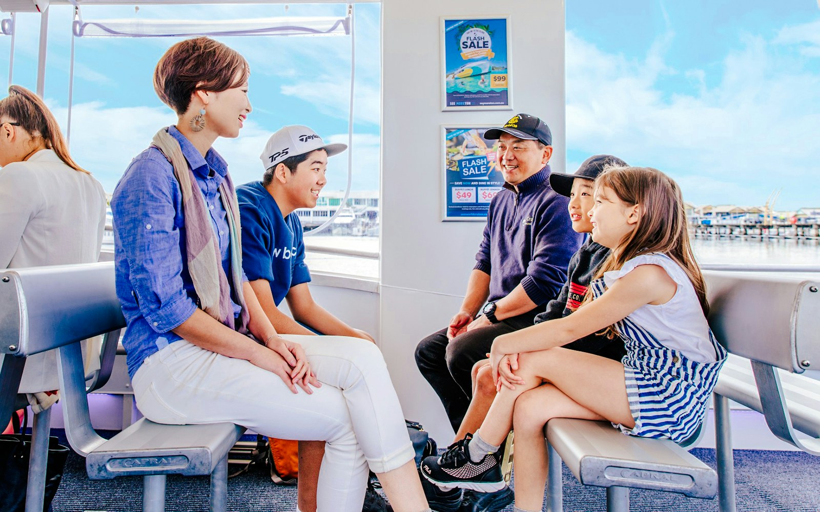 Family enjoying Hop-On Hop-Off Sightseeing Cruise on Gold Coast.