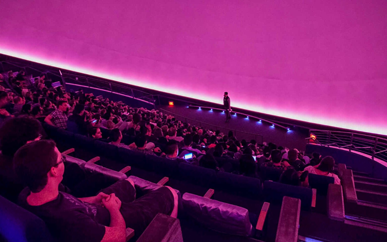 Audience watching a presentation in the planetarium at California Academy of Sciences.