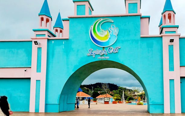 Entrance of Splash Out Langkawi Water Theme Park with colorful archway and towers.