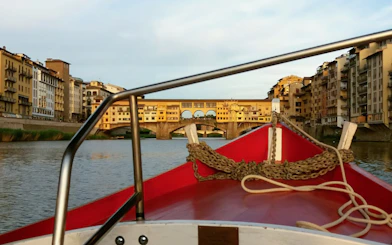 Gondola view of Ponte Vecchio on a guided boat tour in Florence.