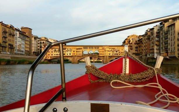 Gondola view of Ponte Vecchio on a guided boat tour in Florence.