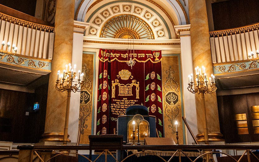 Stadttempel interior with ornate ark and chandeliers, Vienna, Austria.