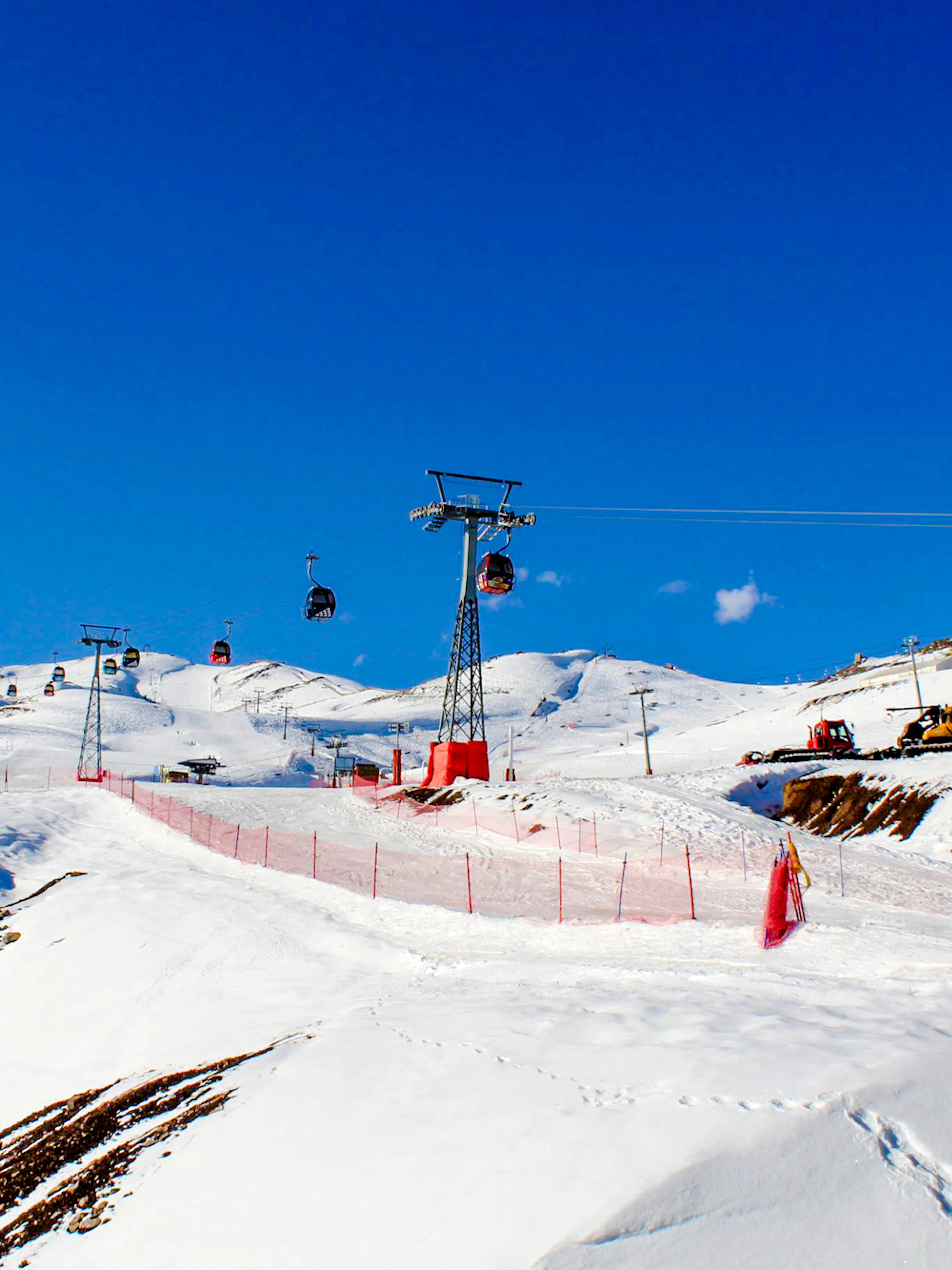 Ski lifts and snowy slopes at Valle Nevado, Santiago tour.