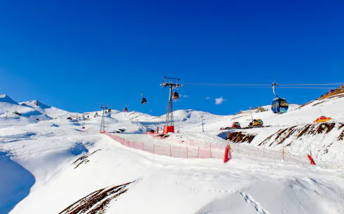 Ski lifts and snowy slopes at Valle Nevado, Santiago tour.