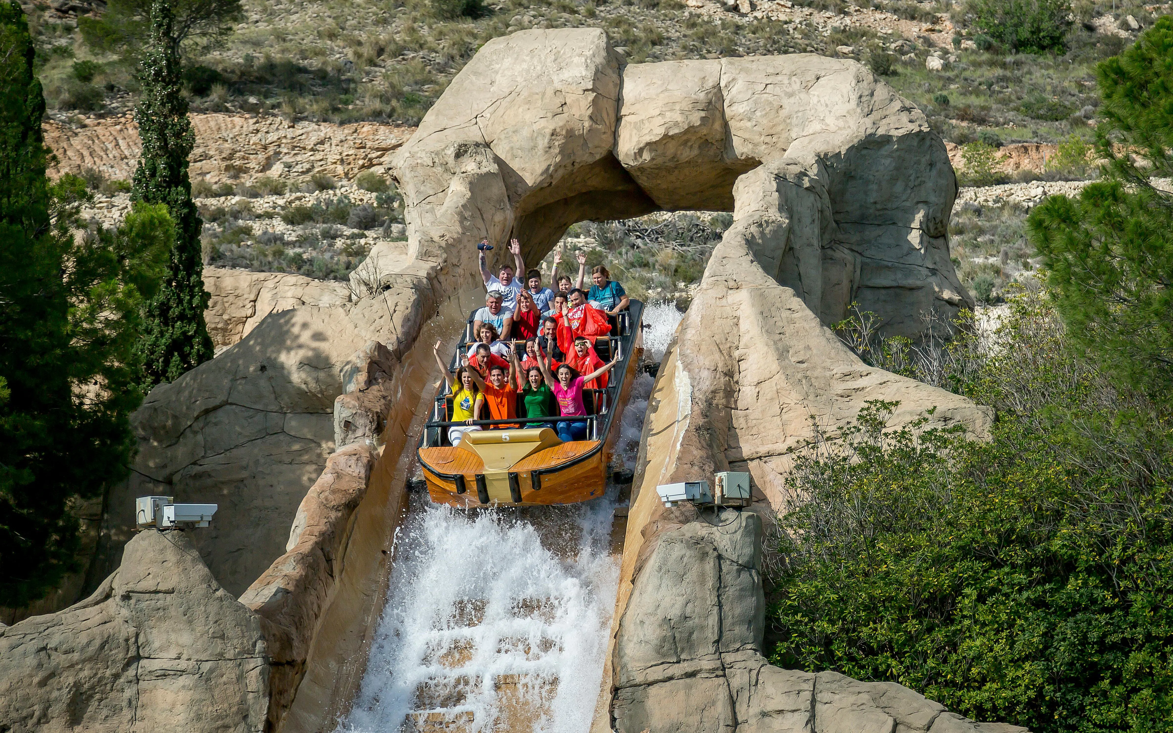 Visitors on a log flume ride at Terra Mitica theme park in Spain.