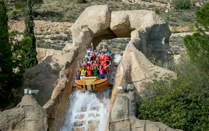 Visitors on a log flume ride at Terra Mitica theme park in Spain.