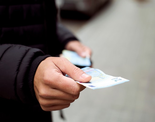 Exchanging euros during a guided tour in Europe.
