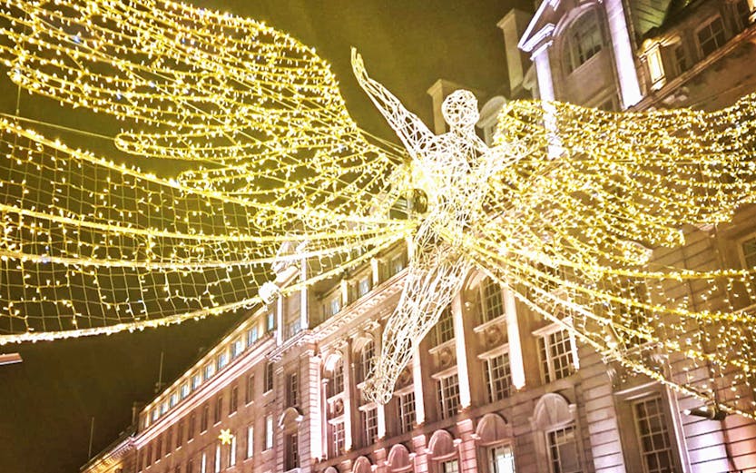 Christmas lights and angel decoration on Regent Street, London.