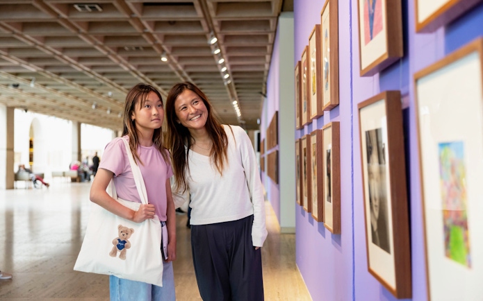 Visitors viewing artwork at Archibald, Wynne & Sulman prizes, Art Gallery of New South Wales, Sydney.