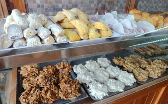 Assorted Dominican pastries and sweets displayed in a bakery during Santo Domingo food tour.