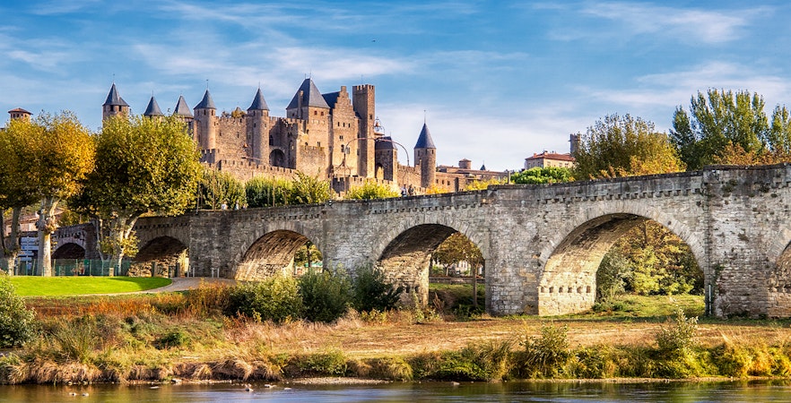 Medieval fortress walls and towers in Carcassonne, France, showcasing historic architecture.