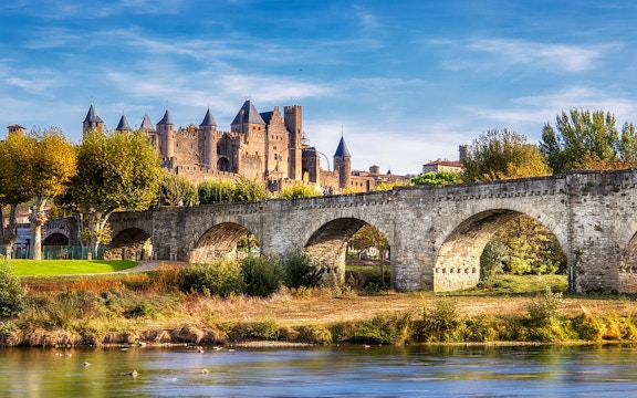 Medieval fortress walls and towers in Carcassonne, France, showcasing historic architecture.
