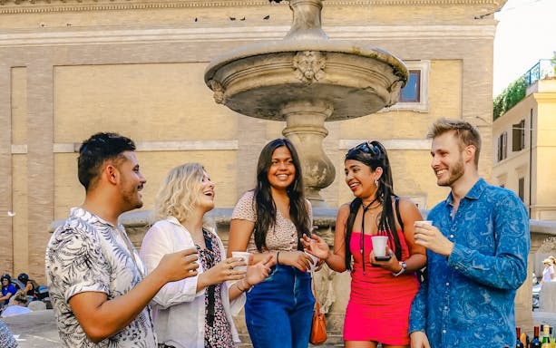 People enjoying a wine tasting experience on the Tipsy Tour in Rome, Italy.