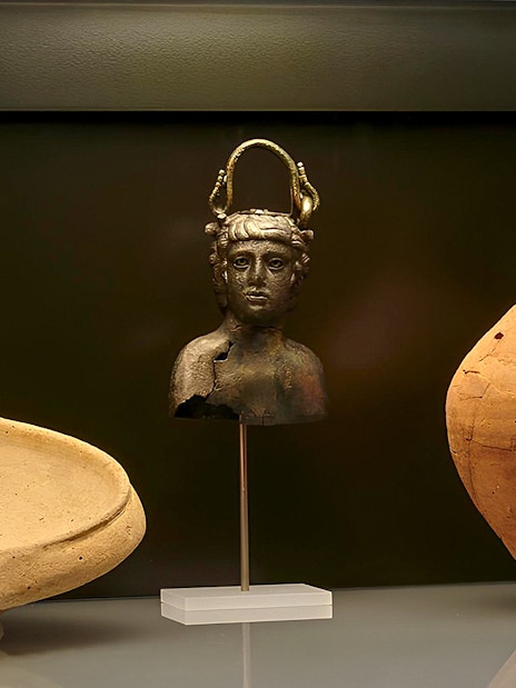 Ancient artifacts display at Carnavalet Museum exhibition.