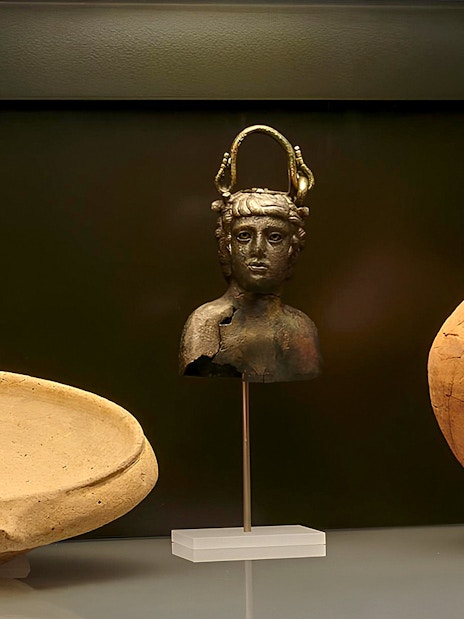 Ancient artifacts display at Carnavalet Museum exhibition.