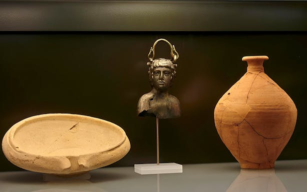 Ancient artifacts display at Carnavalet Museum exhibition.