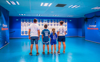 Family viewing memorabilia at Orange Vélodrome during OM Stadium Tour.