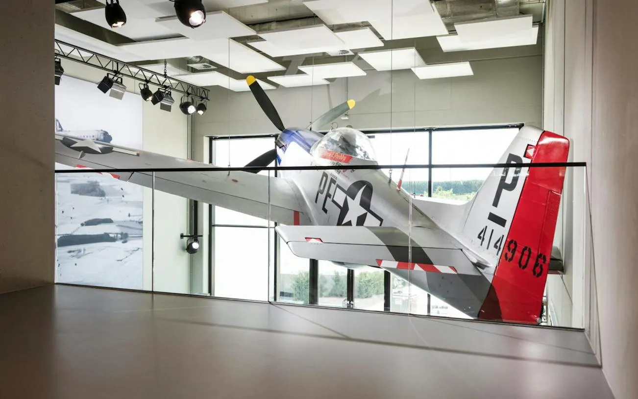World War II aircraft exhibit at Bastogne War Museum, part of Battle of the Bulge tour.