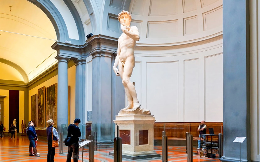 Visitors viewing Michelangelo's David in Hall of the Tribune, Accademia Gallery, Florence.