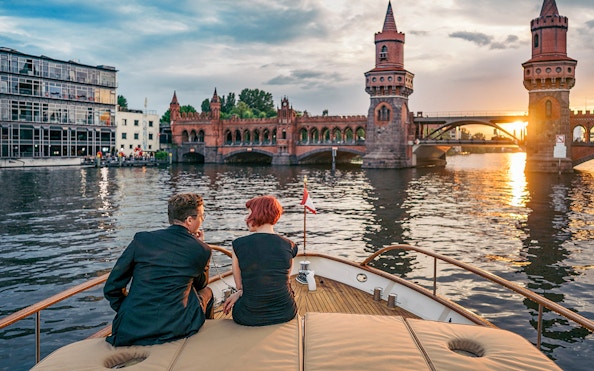 Guests on Fitzgerald boat viewing Oberbaum Bridge during Berlin Sightseeing Cruise.