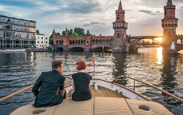 Guests on Fitzgerald boat viewing Oberbaum Bridge during Berlin Sightseeing Cruise.