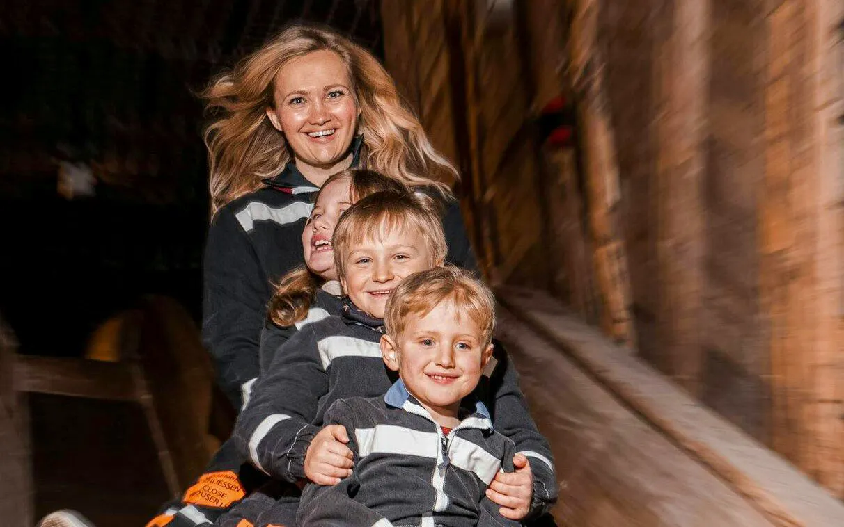 Guests sliding down the miner's slide at Berchtesgaden Salt Mine.