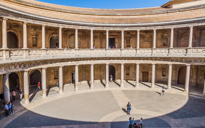 Alhambra's circular courtyard with columns in Granada, Spain.