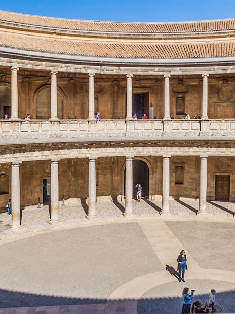 Alhambra's circular courtyard with columns in Granada, Spain.