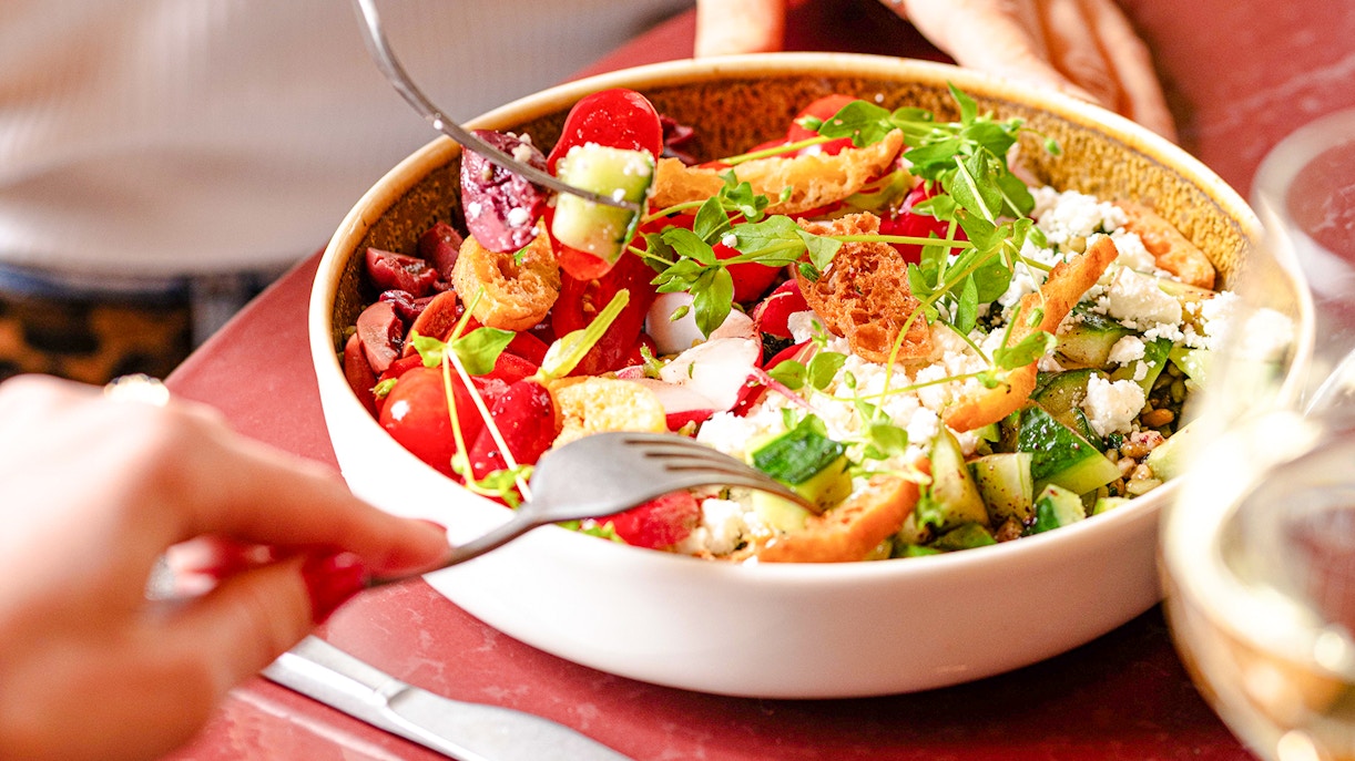 Salad with fresh vegetables and croutons at Brasserie Auteuil.