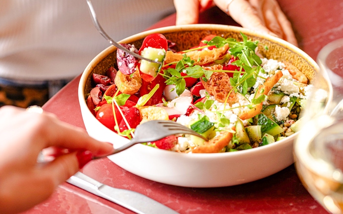 Salad with fresh vegetables and croutons at Brasserie Auteuil.