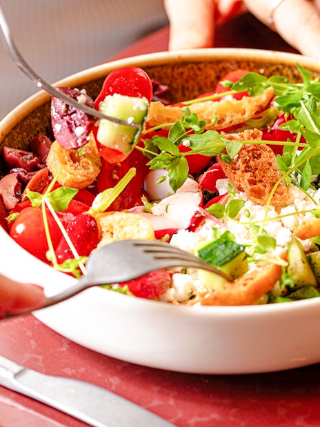 Salad with fresh vegetables and croutons at Brasserie Auteuil.