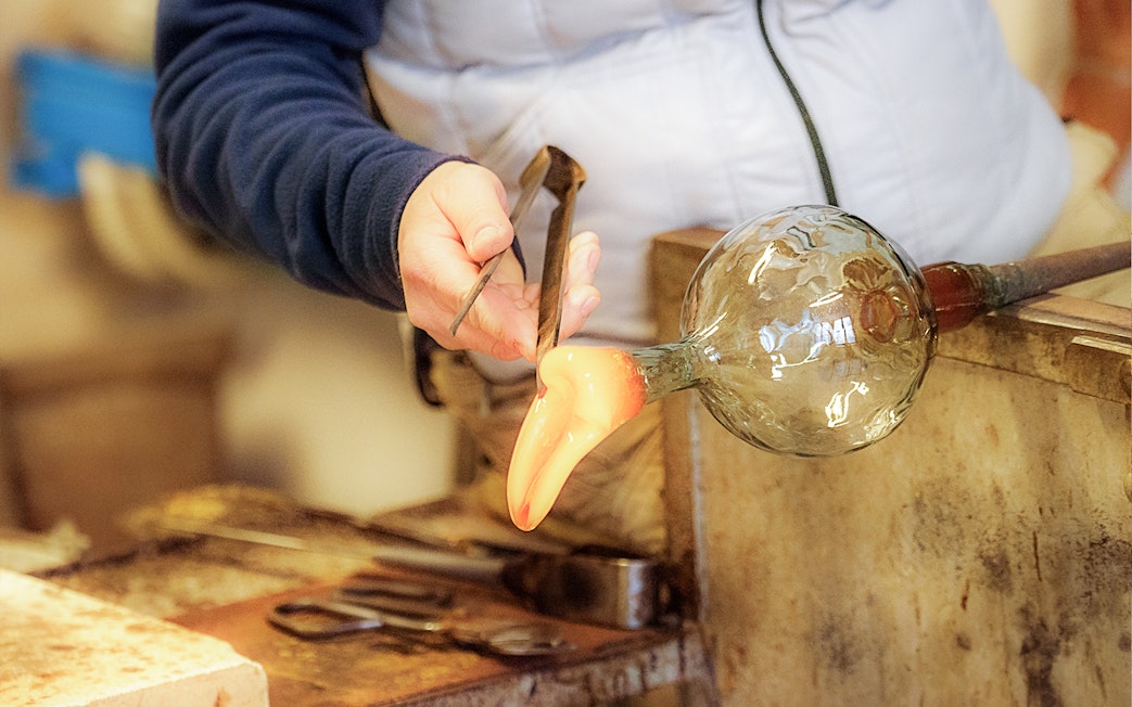 Glassblowing demonstration in Venice during full-day guided tour.