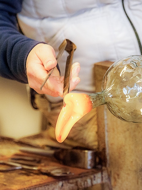 Glassblowing demonstration in Venice during full-day guided tour.