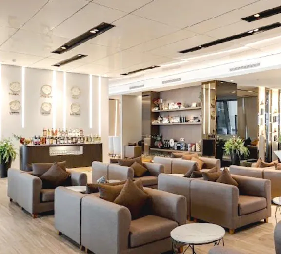 Miracle Lounge seating area with sofas and tables, Bangkok Airport, Thailand.