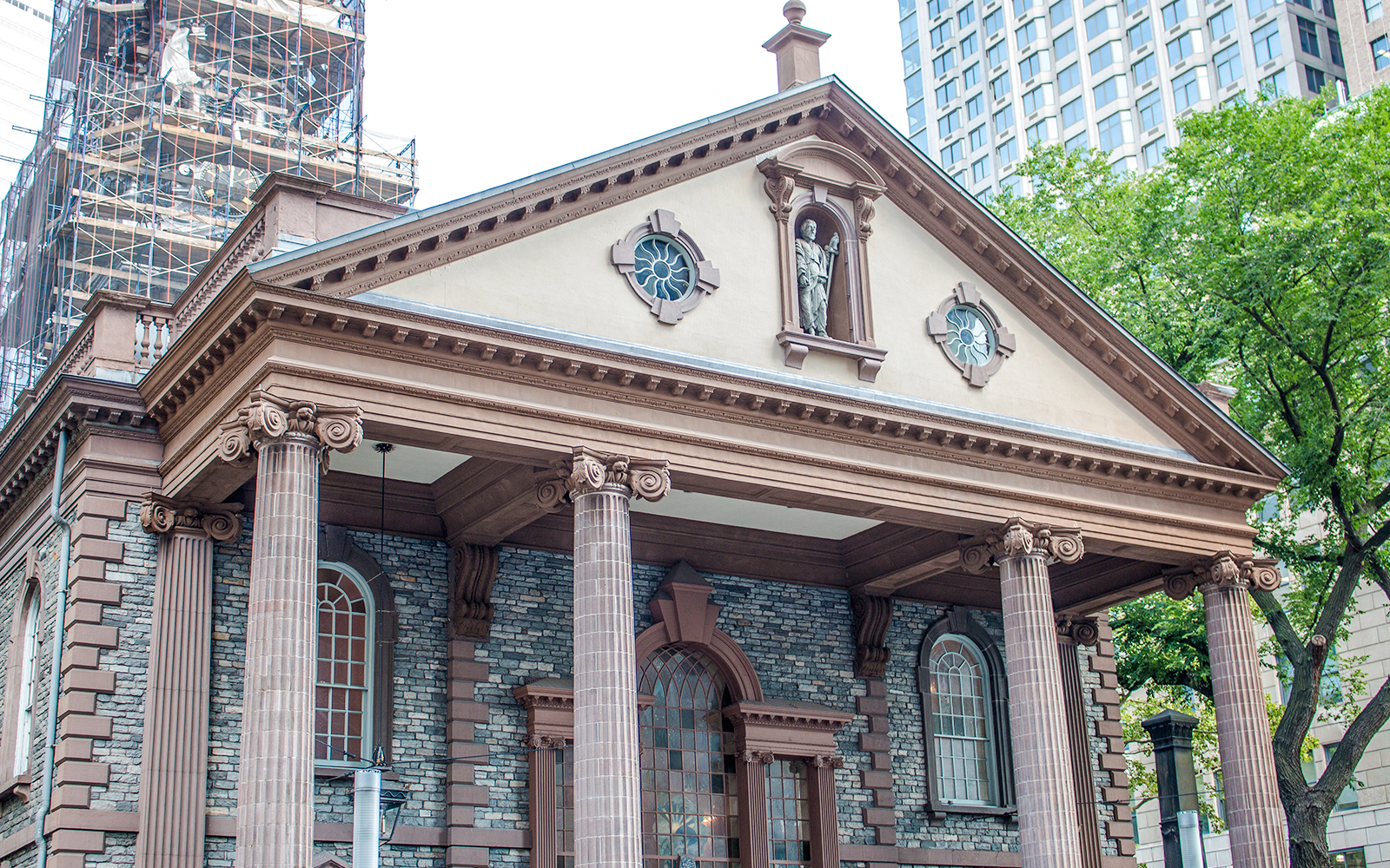 St. Paul’s Chapel facade with columns and statue, Manhattan, New York City.