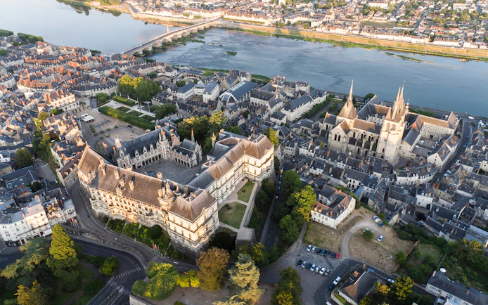 Aerial view of Royal Blois Castle and surrounding town in Blois, France, near the Loire River.