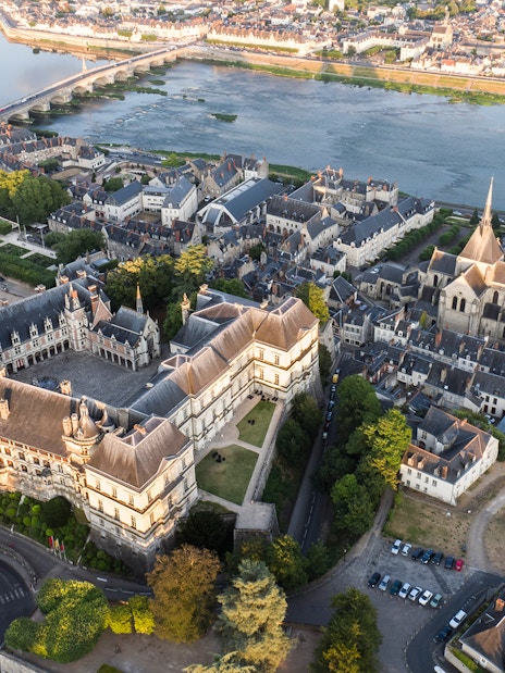 Aerial view of Royal Blois Castle and surrounding town in Blois, France, near the Loire River.